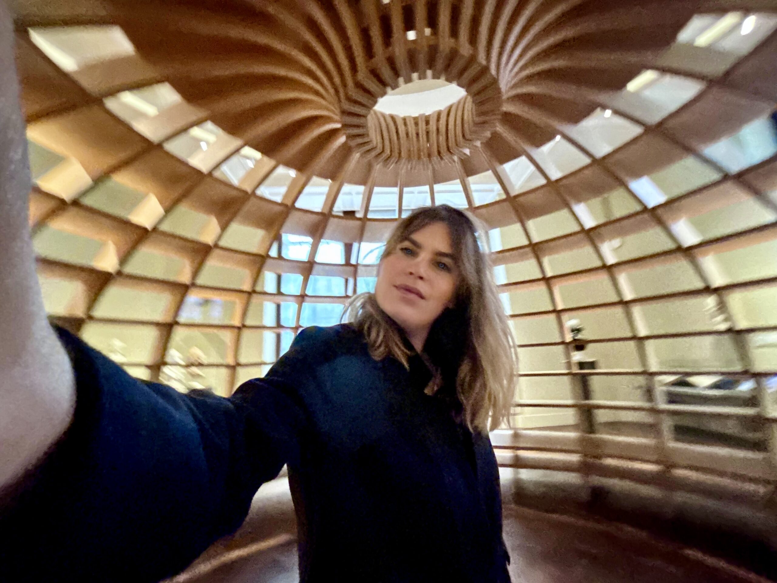 Olga Mack in the Globe Statite at V&A, a metaphor for being in the center of knowledge and a perfect prison where one person can watch everyone, representing the legal function.