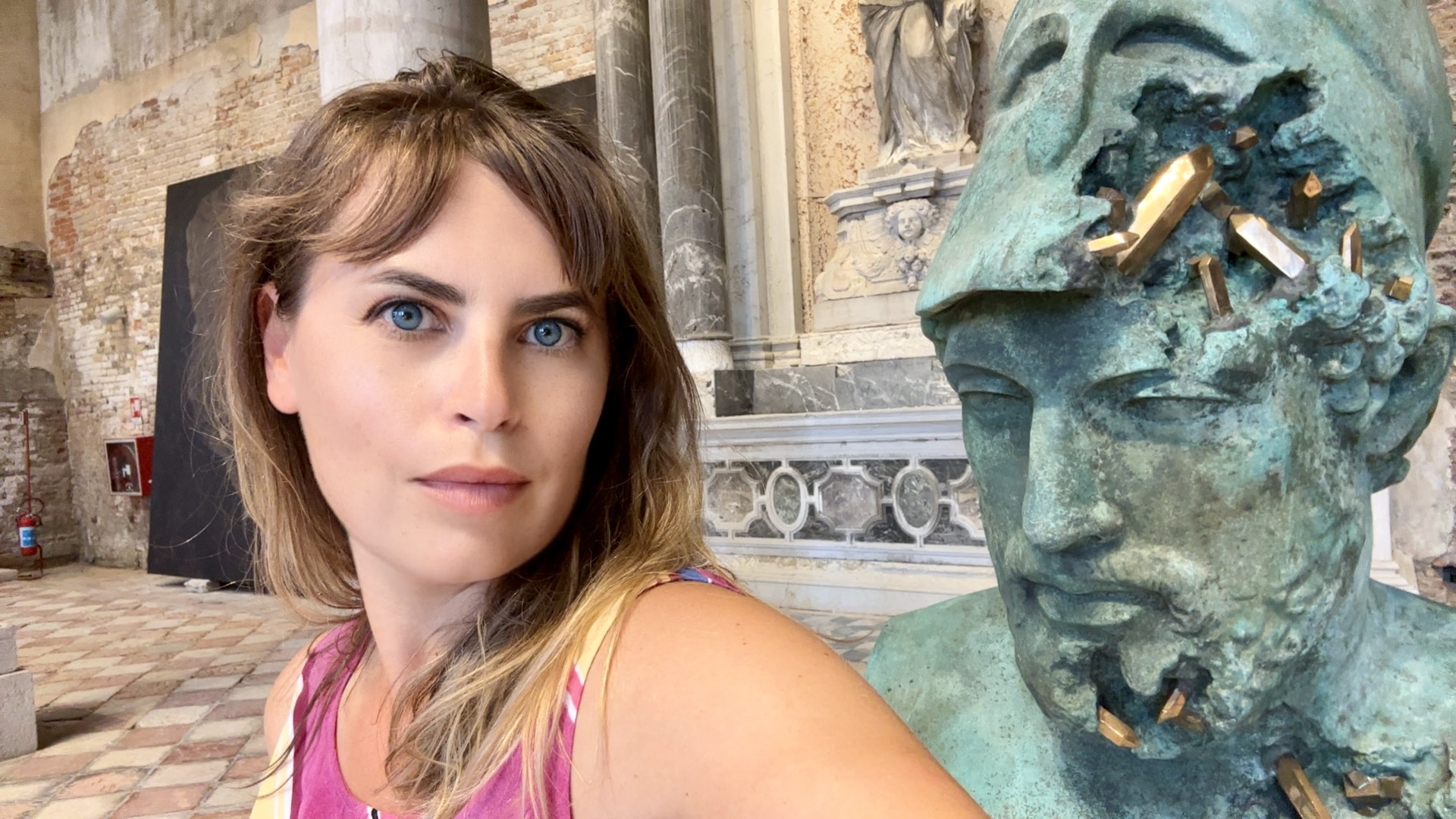 Olga Mack standing beside a disintegrating antiquity statue, symbolizing the balance between AI innovation and ethical stewardship.